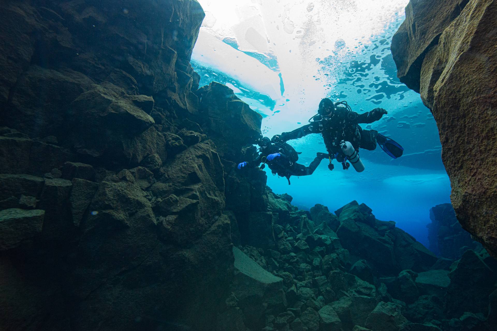 Divers under the ice in Davidsgja lake Thingvellir